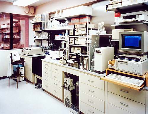 clinical laboratory desktop monitor beside computer tower on inside room healthcare